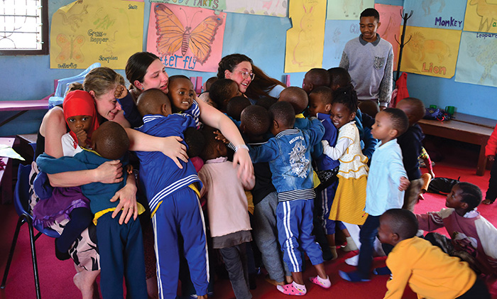 A group hug with daycare children.<br />
